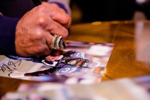 Seahawk great Shaun Alexander signing autographs, wearing his championship ring  